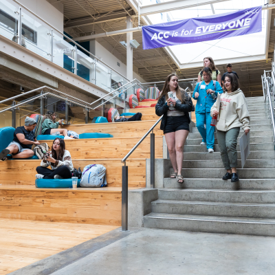 Students walking down the social staircase at highland campus.